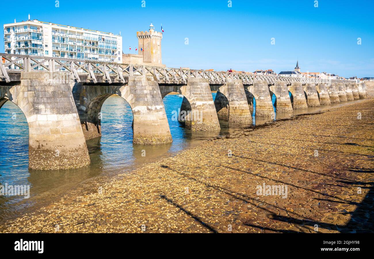 Scenic view of the old port pier with Arundel tower in background in Les Sables d’Olonne city on sunny summer day in Vendée France Stock Photo