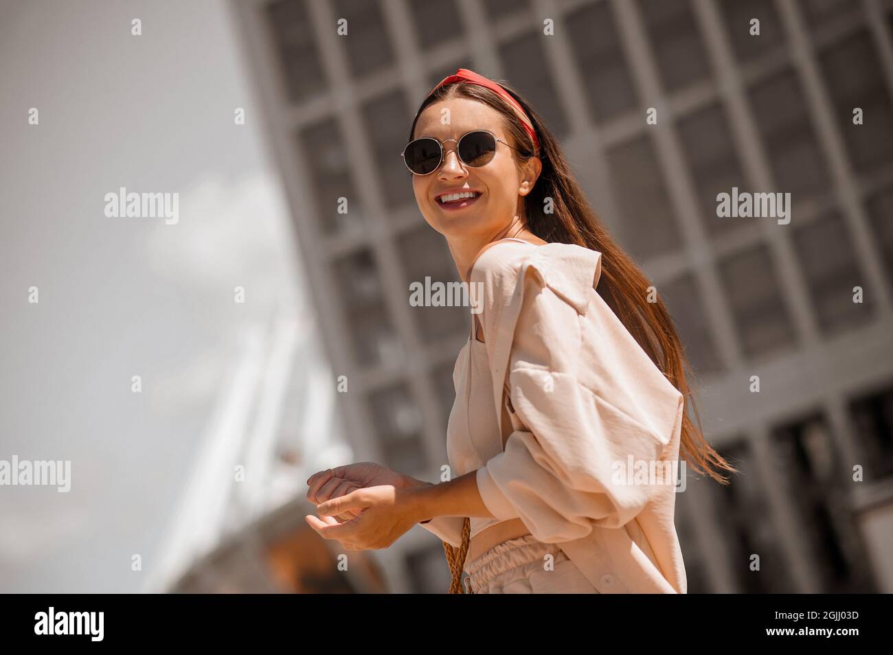 Young happy woman in beige hi-res stock photography and images - Alamy