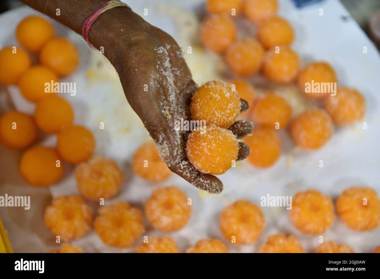 Motichur Ladoos are special type of sweet offered to the elephant-headed God, Lord Ganesha as bhog. Ganesh Chaturthi, one of the most auspicious festivals in the Hindu calendar, marks the beginning of the 10-day festivities. Also known as Vinayaka Chaturthi, the celebrations begin with bringing home an idol of Lord Ganesha. Food forms an important part of Ganesh Chaturthi celebrations. Among the many desserts to fruits that are part of the festivities, modaks and ladoo. (Photo by Sukhomoy Sen/Pacific Press) Stock Photo