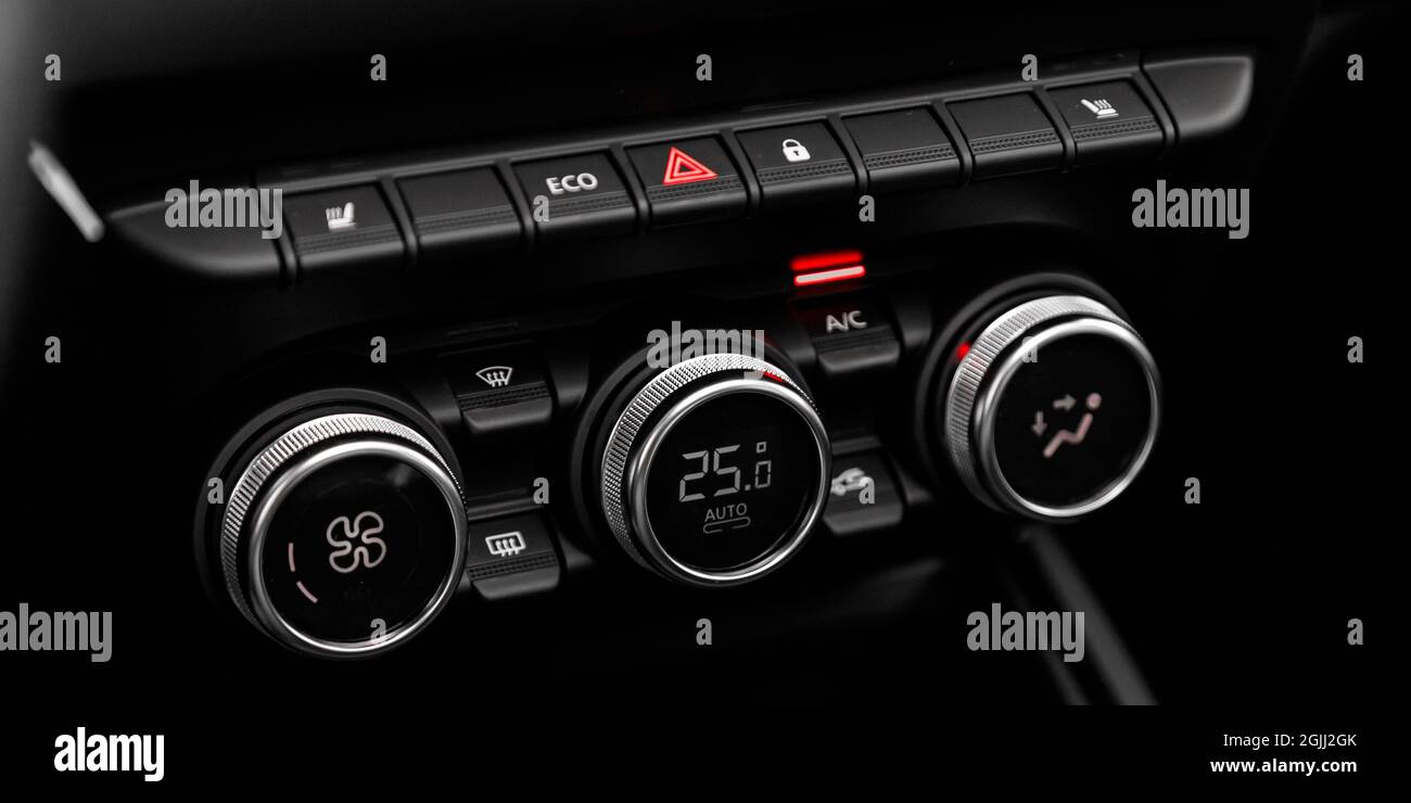Black detail with the air conditioning button inside a car Stock Photo