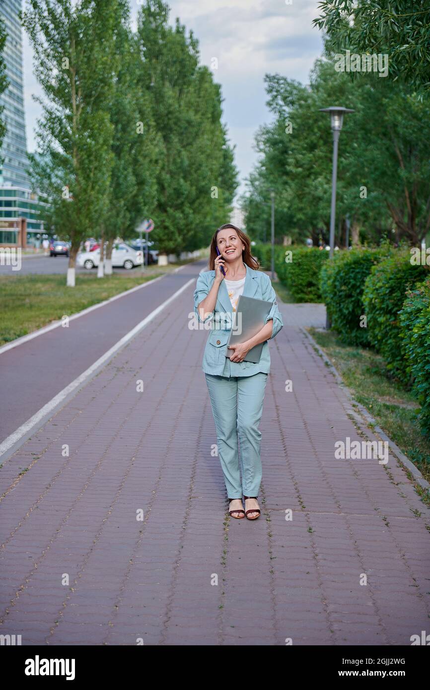 Beautiful girl on sidewalk walking hi-res stock photography and images ...