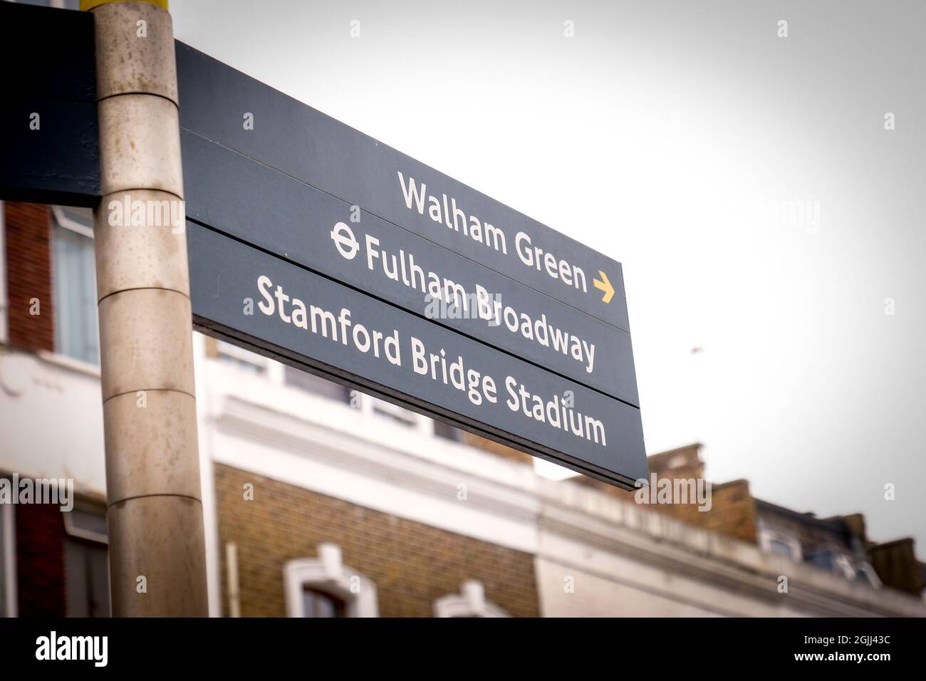 London, September 2021: Street direction sign for Walham Green, Fulham Broadway and Chelsea FC's Stamford Bridge Stadium Stock Photo