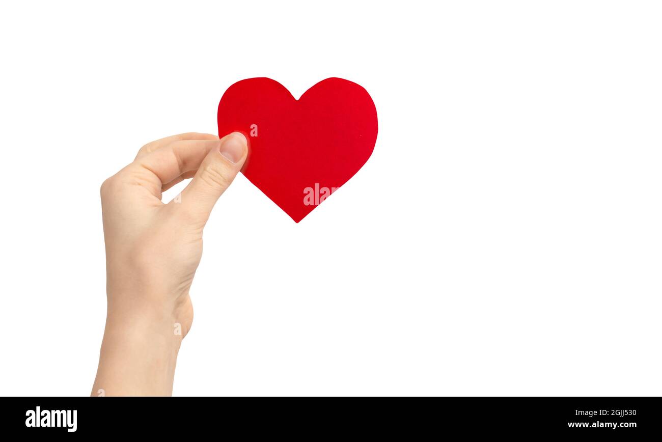Child charity concept. Hand holding red heart isolated on a white background. Copy space Stock Photo - Alamy Child charity concept. Hand holding red heart isolated on a white background. Copy space Stock Photo - Alamy