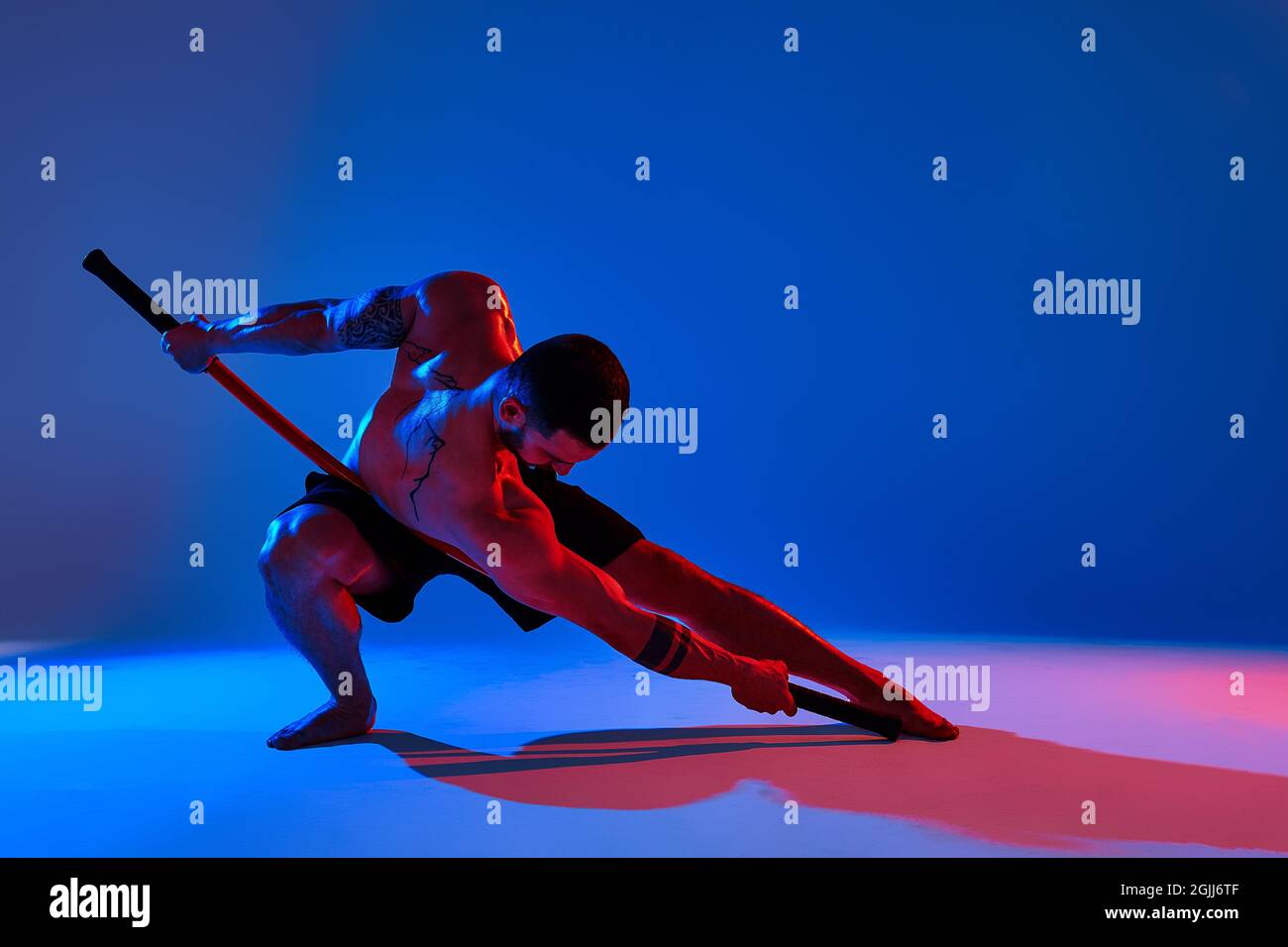 athlete men silhouette with stick training karate using sports tool in ...