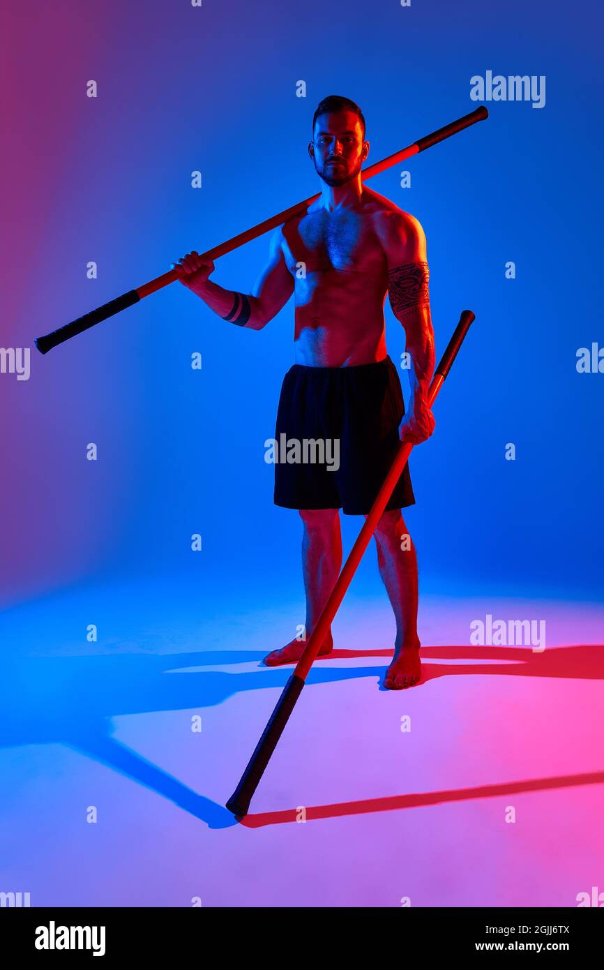 athlete men silhouette with stick training karate using sports tool in ...