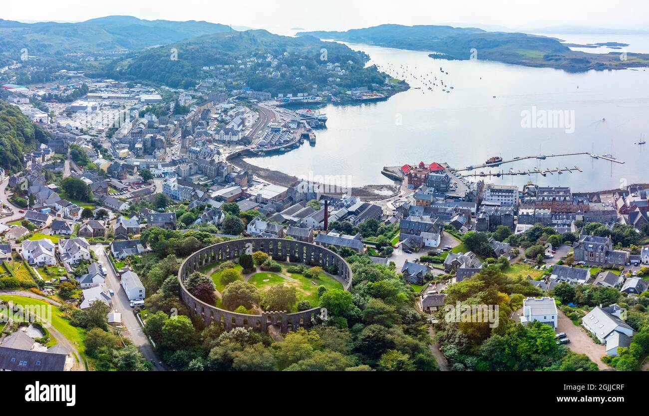 Aerial view from drone of McCaig’s Tower and skyline of  Oban, Argyll and Bute, Scotland, UK Stock Photo