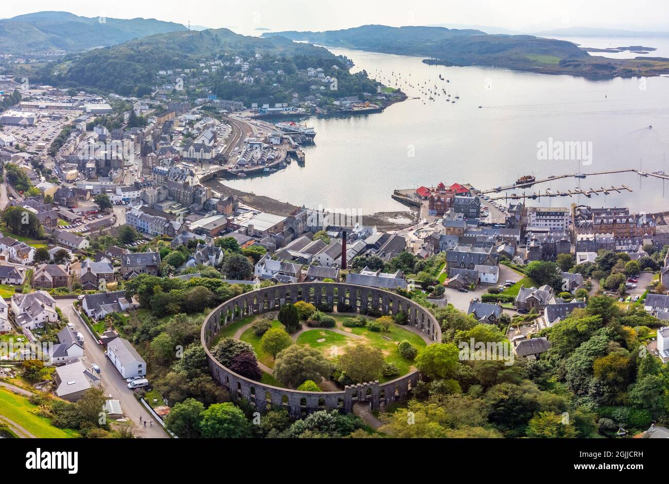 Aerial view from drone of McCaig’s Tower and skyline of  Oban, Argyll and Bute, Scotland, UK Stock Photo