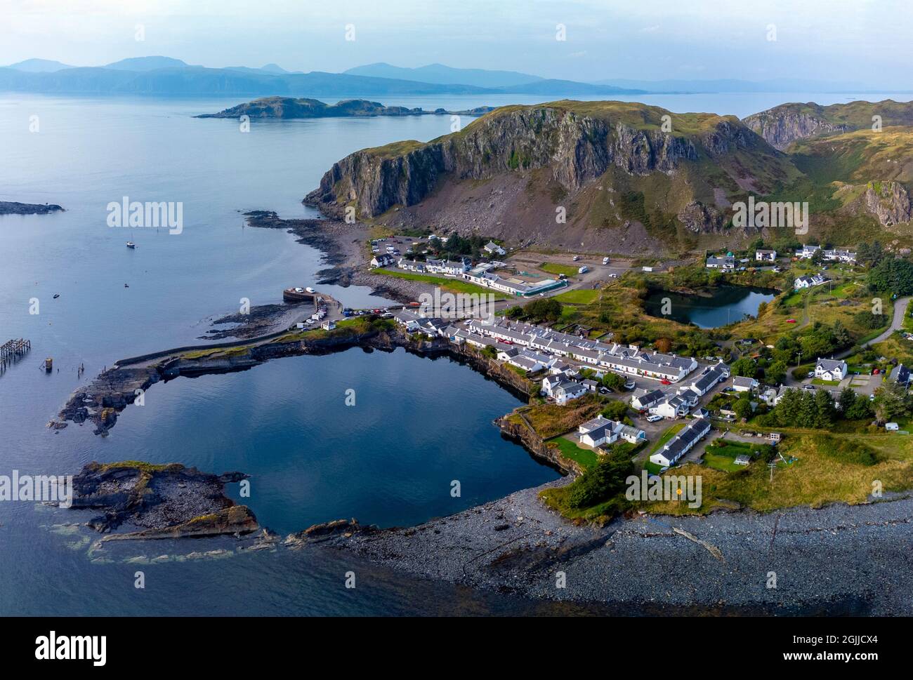 Aerial view from drone of former slate quarry and village of Ellenabeich at Easdale on Seil Island, one of the slate islands, Argyll and Bute, Scotlan Stock Photo