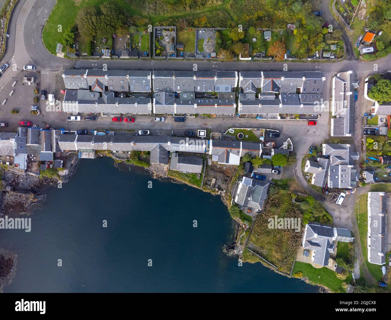 Aerial view from drone of former slate quarry and village of  Ellenabeich at Easdale on Seil Island, one of the slate islands, Argyll and Bute, Scotla Stock Photo