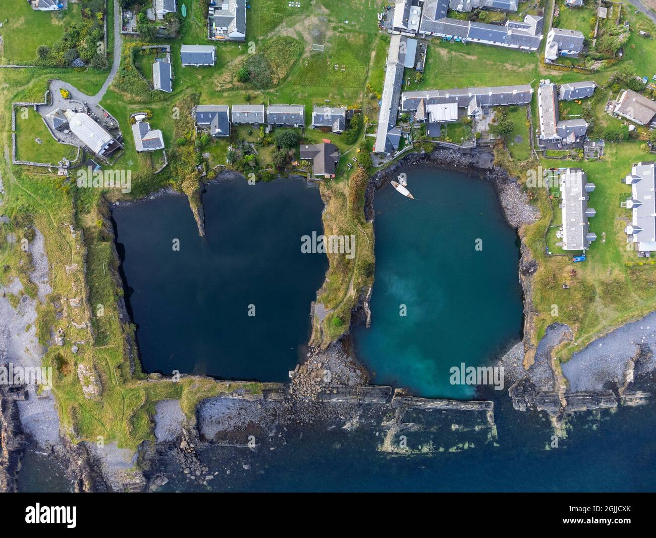 Drone view of flooded slate quarries on Easdale Island on one of the slate islands, Argyll and Bute, Scotland, UK Stock Photo