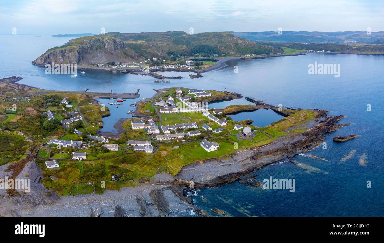 Aerial view from drone of slate islands with Easdale Island front and Ellenabeich village on Seil Island in distance, Argyll and Bute, Scotland, UK Stock Photo
