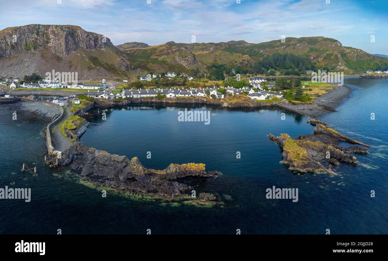 Aerial view from drone of former slate quarry and village of  Ellenabeich at Easdale on Seil Island, one of the slate islands, Argyll and Bute, Scotla Stock Photo