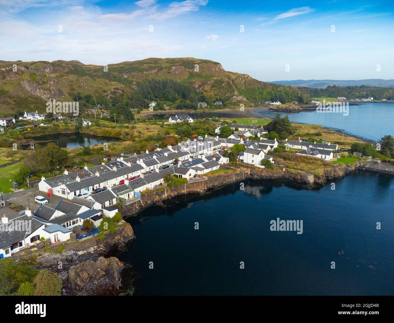 Aerial view from drone of former slate quarry and village of  Ellenabeich at Easdale on Seil Island, one of the slate islands, Argyll and Bute, Scotla Stock Photo