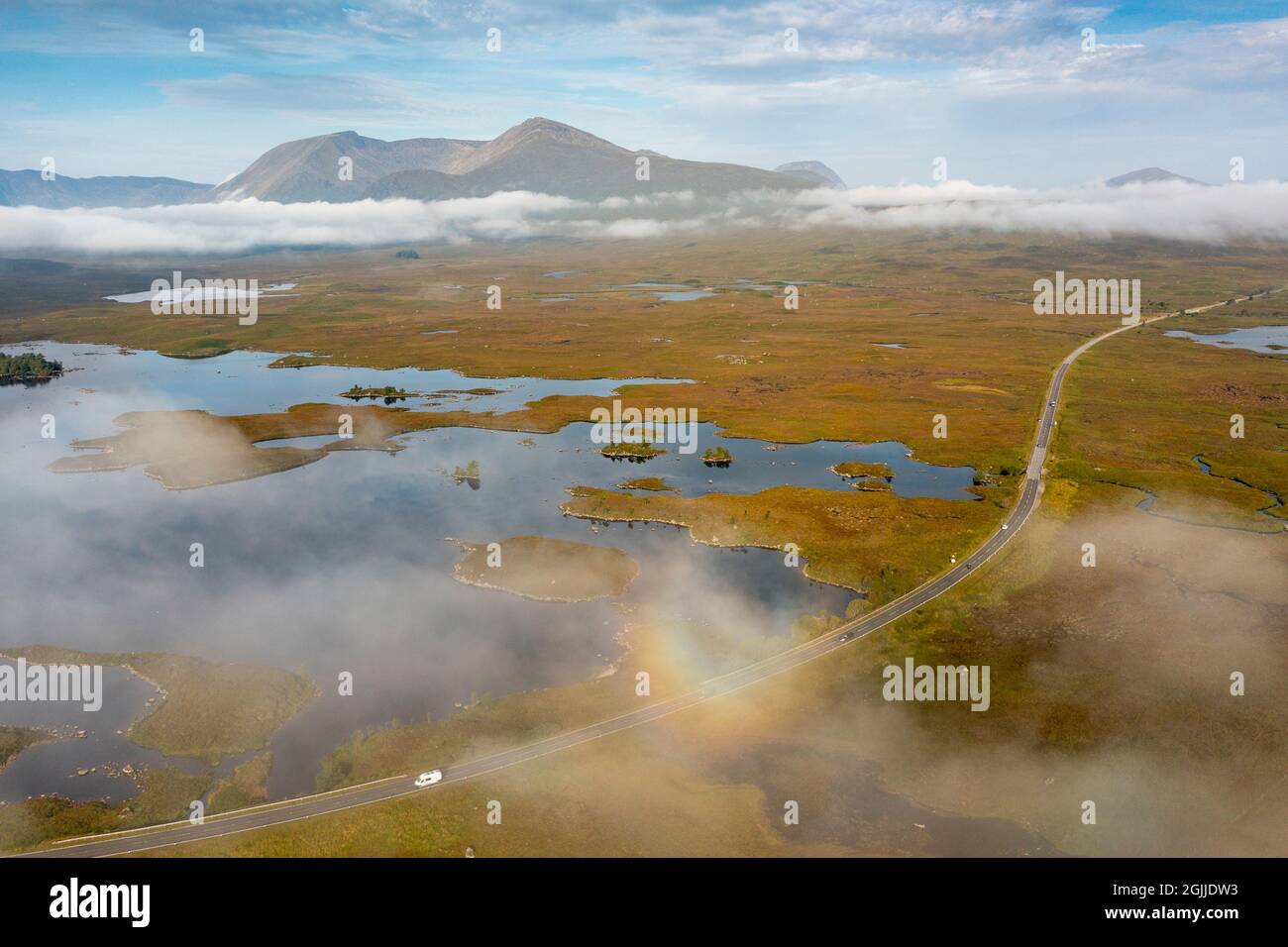 Early morning view of Rannoch Moor and A82 road  in the mist from drone, Scottish highlands, Scotland, UK Stock Photo