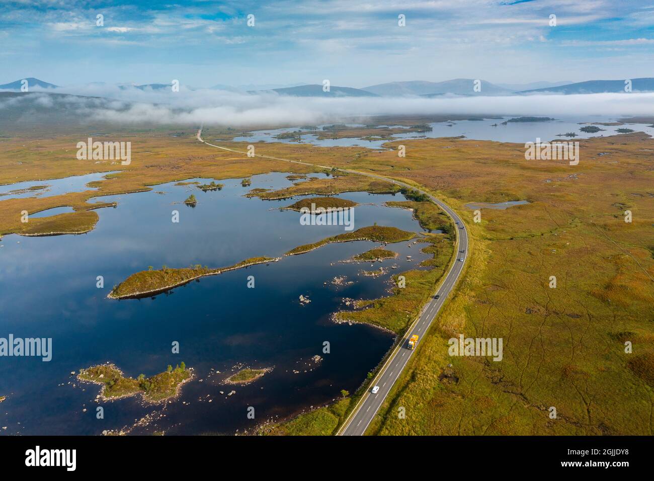Early morning view of Rannoch Moor and A82 road  in the mist from drone, Scottish highlands, Scotland, UK Stock Photo