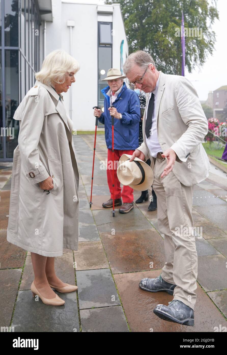 The Duchess of Cornwall, known as the Duchess of Rothesay when in Scotland, meets the Queen's Sculptor in Ordinary in Scotland Sandy Stoddart during a visit to Nairn Book and Arts Festival and the environment Charity, Green Hive, at Nairn Community Centre in Nairn. Picture date: Friday September 10, 2021. Stock Photo