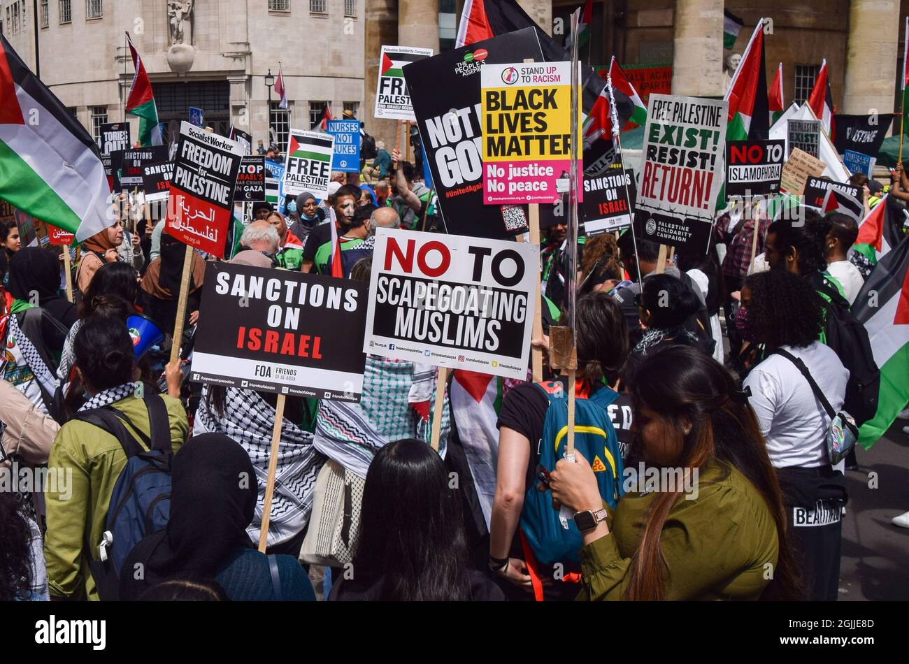 London, United Kingdom. 26th June 2021. A protester holds a 'No To Scapegoating Muslims' placard on Regent Street. Several protests took place in the capital, as pro-Palestine, Black Lives Matter, Kill The Bill, Extinction Rebellion, anti-Tory demonstrators, and various other groups marched through Central London. Stock Photo