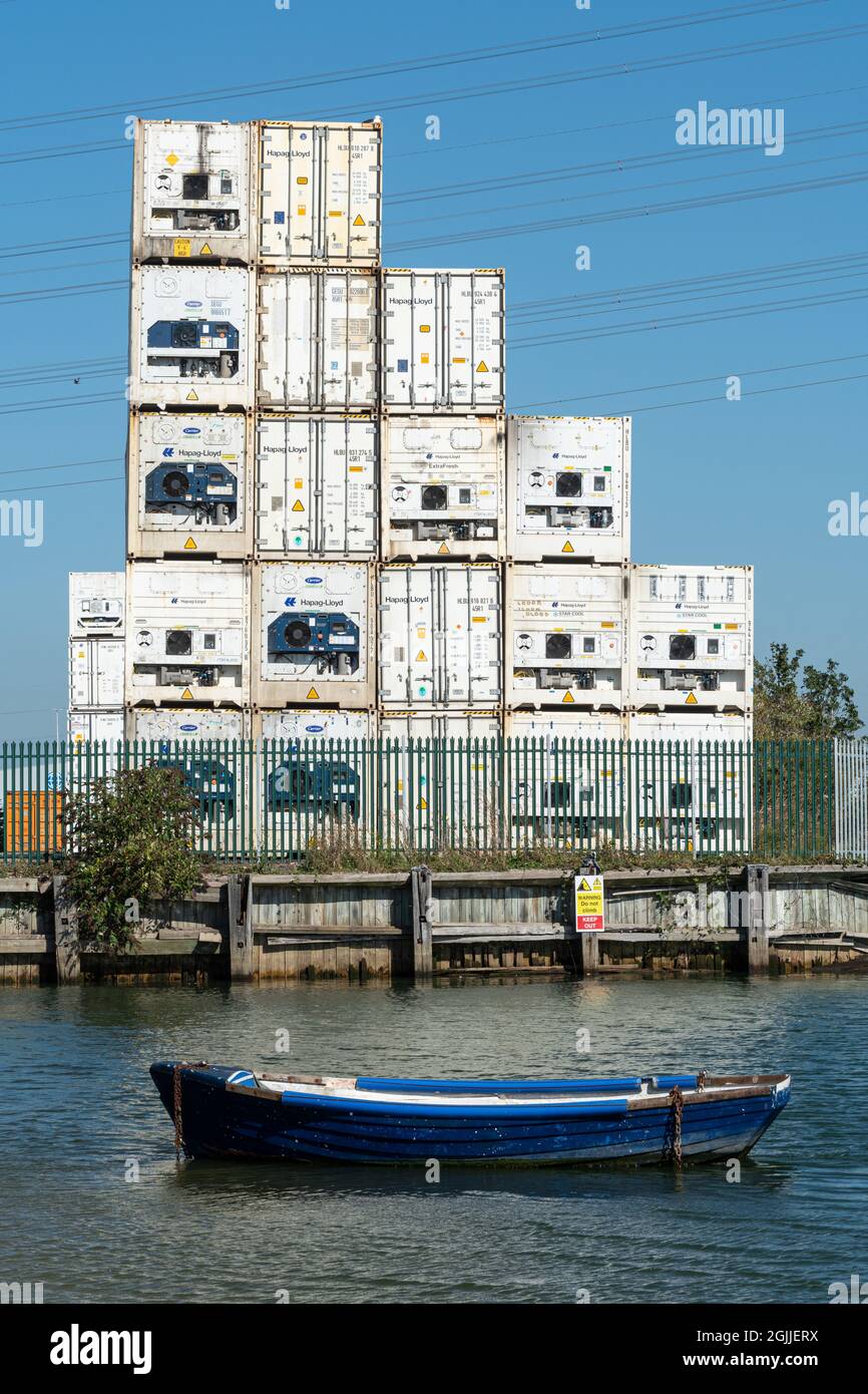 Hapag-Lloyd shipping containers stacked up at Eling Wharf on Southampton Water, Hampshire, England, UK Stock Photo