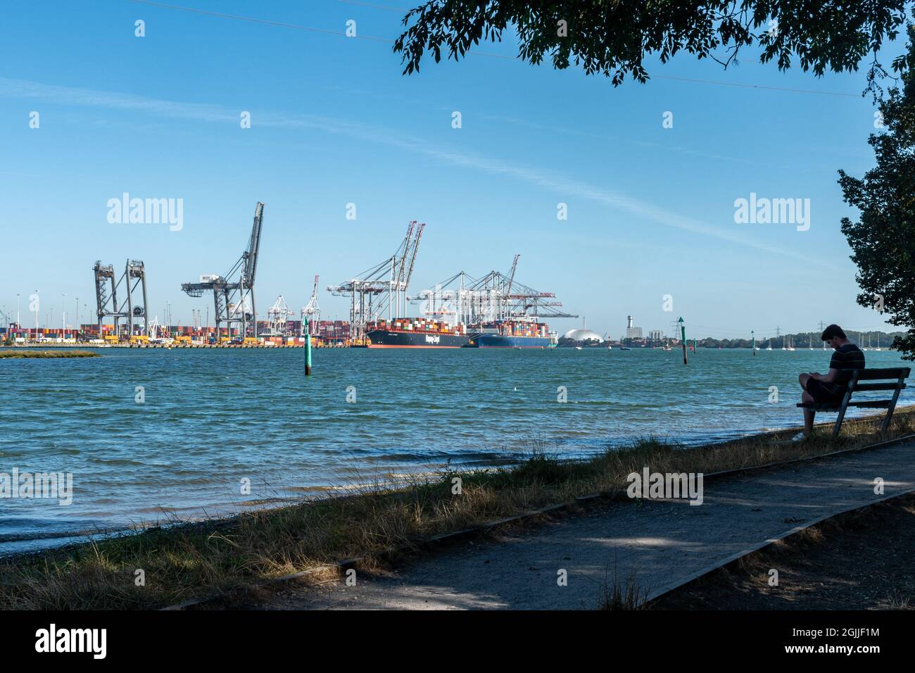 Port of Southampton (Southampton docks) in Hampshire, England, UK. View of the cargo port or container terminal from Goatee beach. Stock Photo