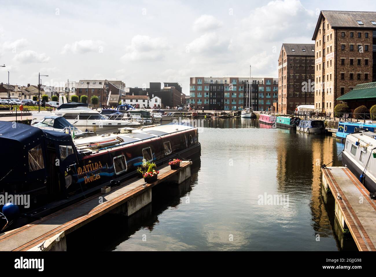 View of Modern apartment blocks and traditional canal craft at Gloucester Stock ...
