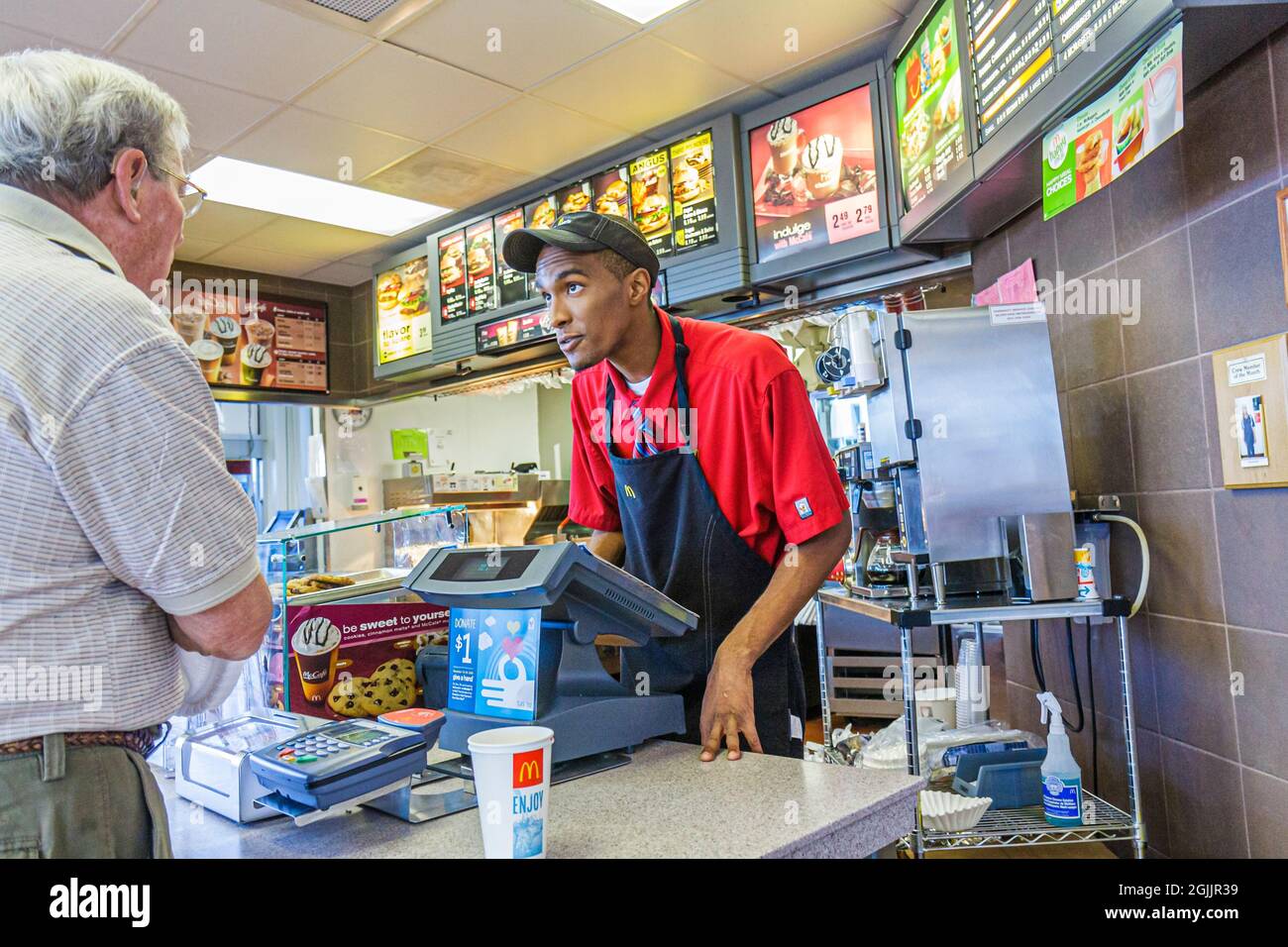 Georgia South Newport,McDonald's restaurant fast food Black man male,cashier working employee worker customer counter taking order Stock Photo