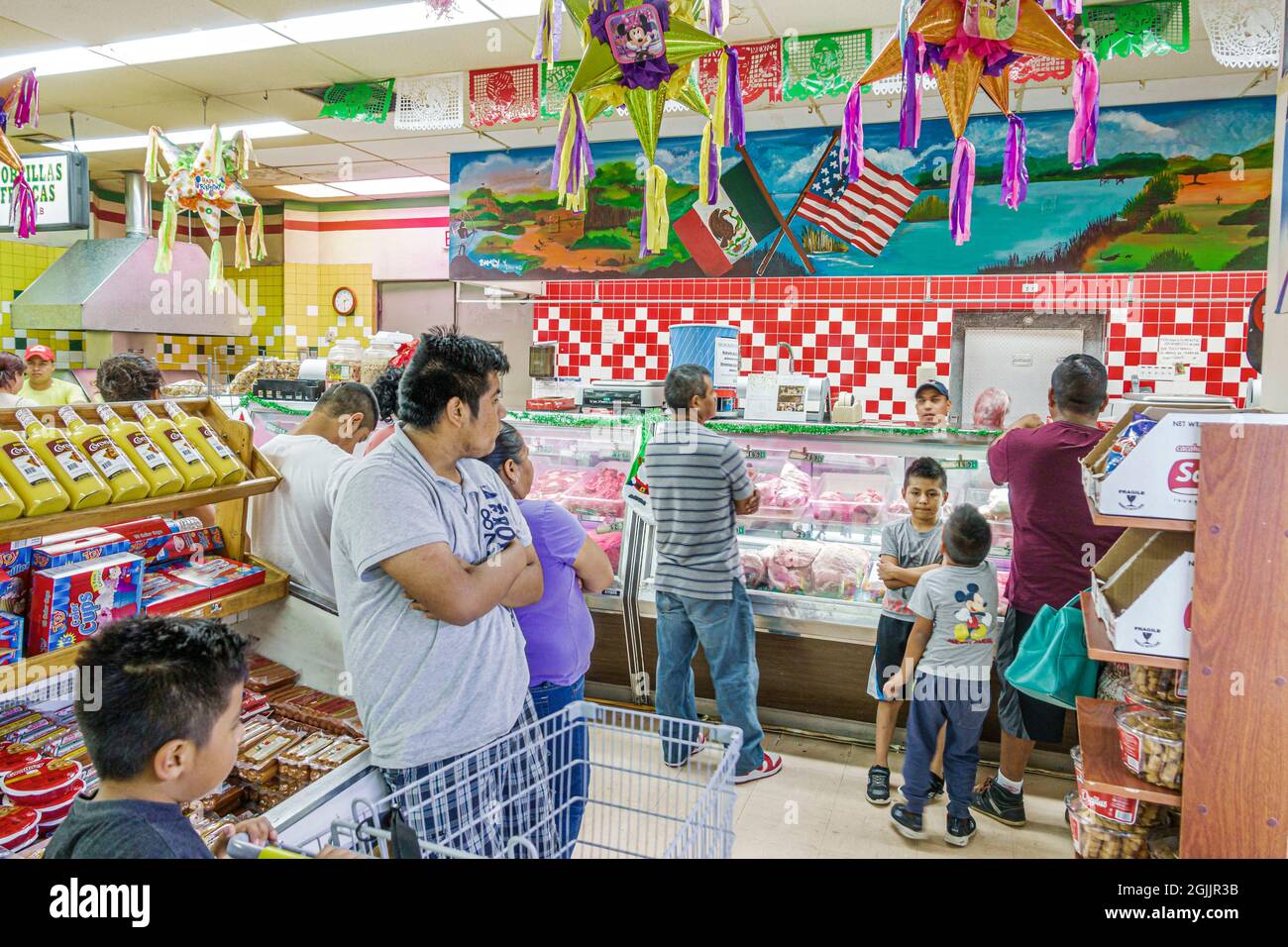 Florida Homestead,Mexico Market,Hispanic grocery supermarket food inside,display sale,shop market store business kids children family parents pinatas Stock Photo