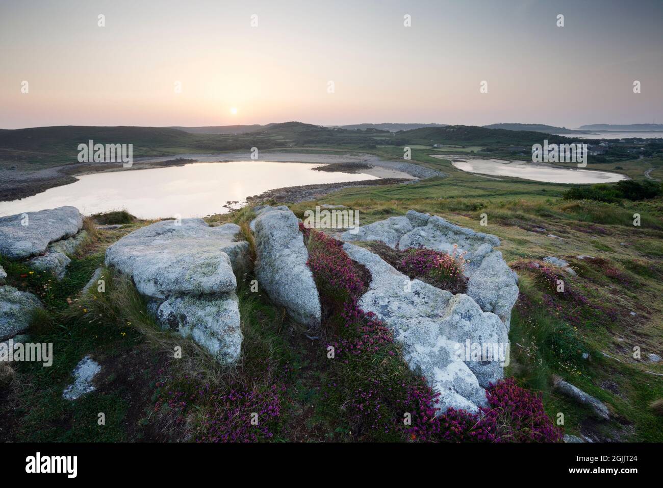 Sunrise over Bryher. Isles of Scilly, Cornwall, UK.  View from Gweal Hill over Popplestones Bay. Stock Photo