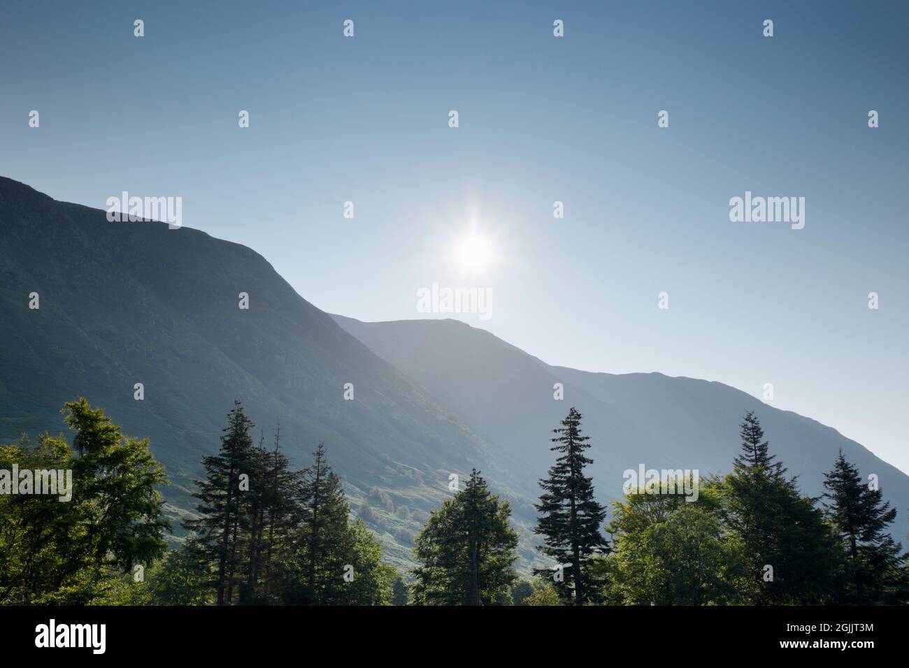 Morning Sun rises over Ben Nevis. Lochaber, Highland, Scotland, UK. Stock Photo