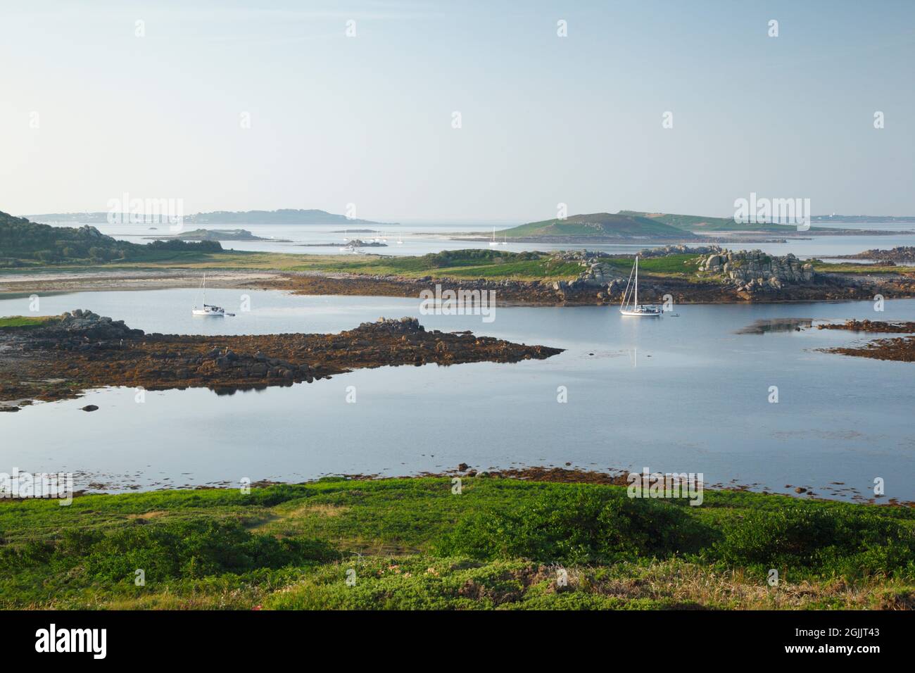 Bryher. Isles of Scilly. Cornwall. UK. View from Gweal Hill over Stinking Porth towards Samson, with St Mary's and St Agnes in the far distance. Stock Photo