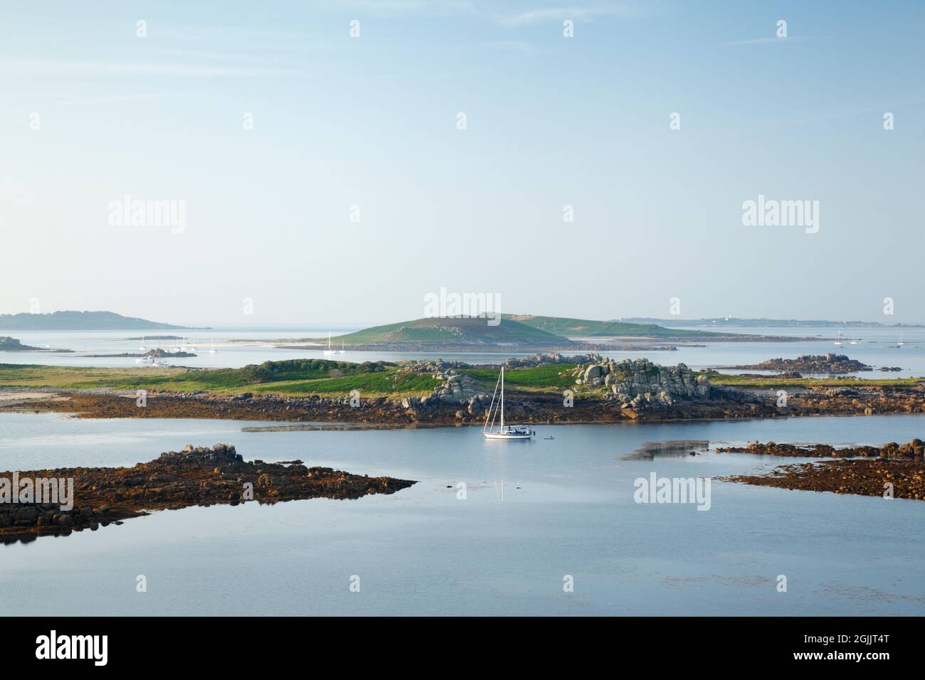 Bryher. Isles of Scilly. Cornwall. UK. View from Gweal Hill over Stinking Porth towards Samson; with St Mary's and St Agnes in the far distance. Stock Photo