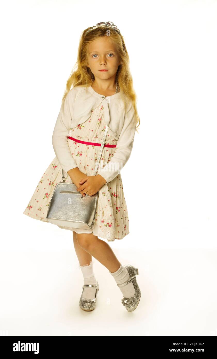 A sweet little blond girl posing for thre camera Stock Photo