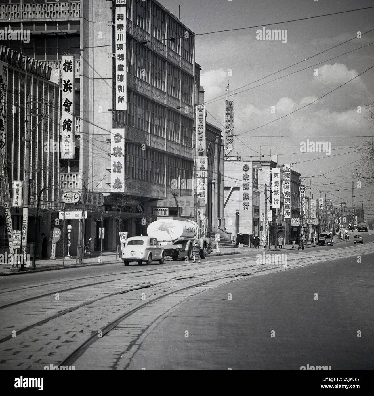 1950s, historical, tram-lines in the road in the old town area of Tokyo, Japan. Stock Photo