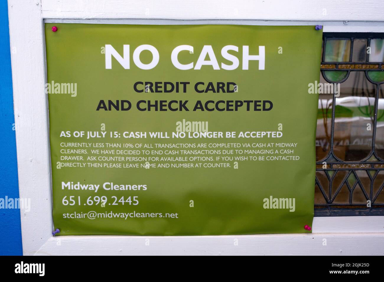 Sign for Midway Cleaners no longer accepting cash for payment, only credit card or check. St Paul Minnesota MN USA Stock Photo