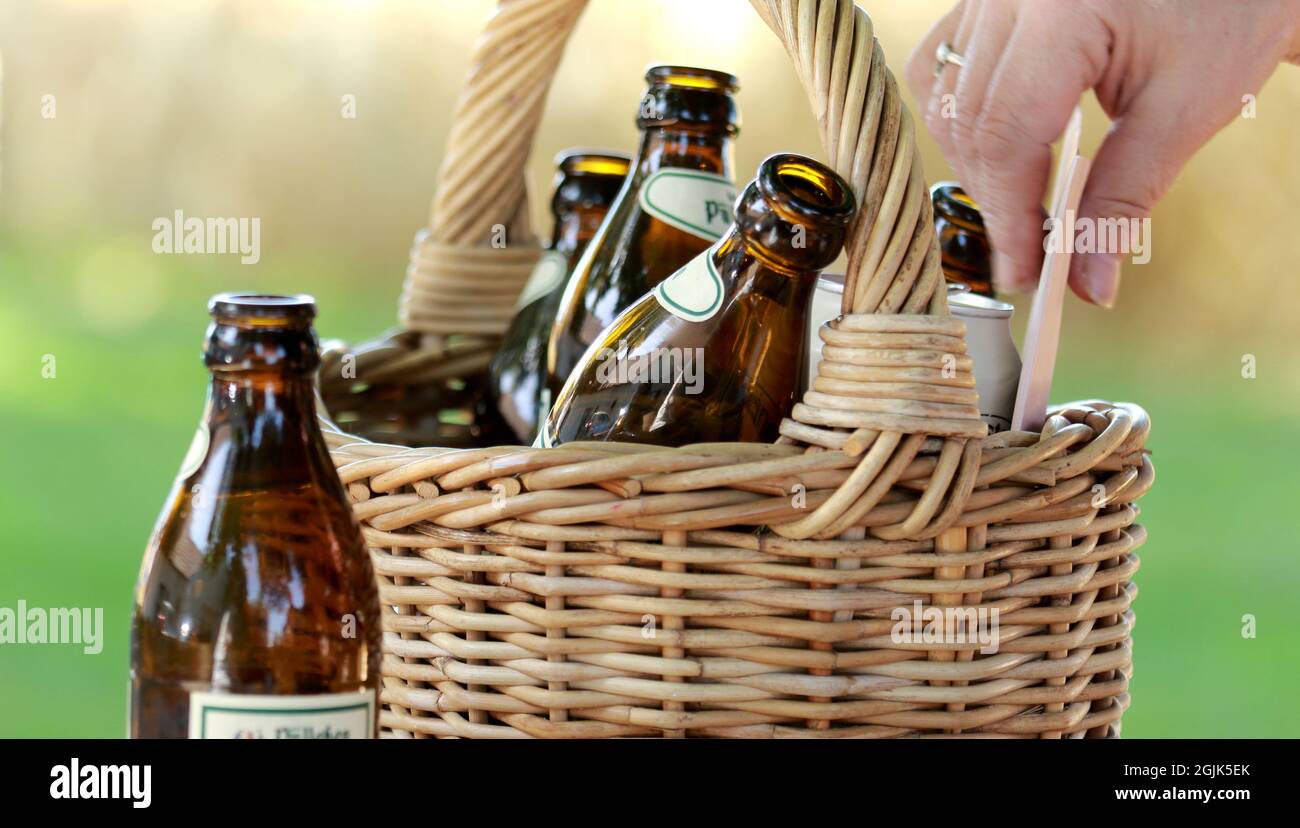 MINDE, GERMANY - Sep 02, 2021: there are puelleken bottles in the basketit's beer from the sauerland in germany Stock Photo