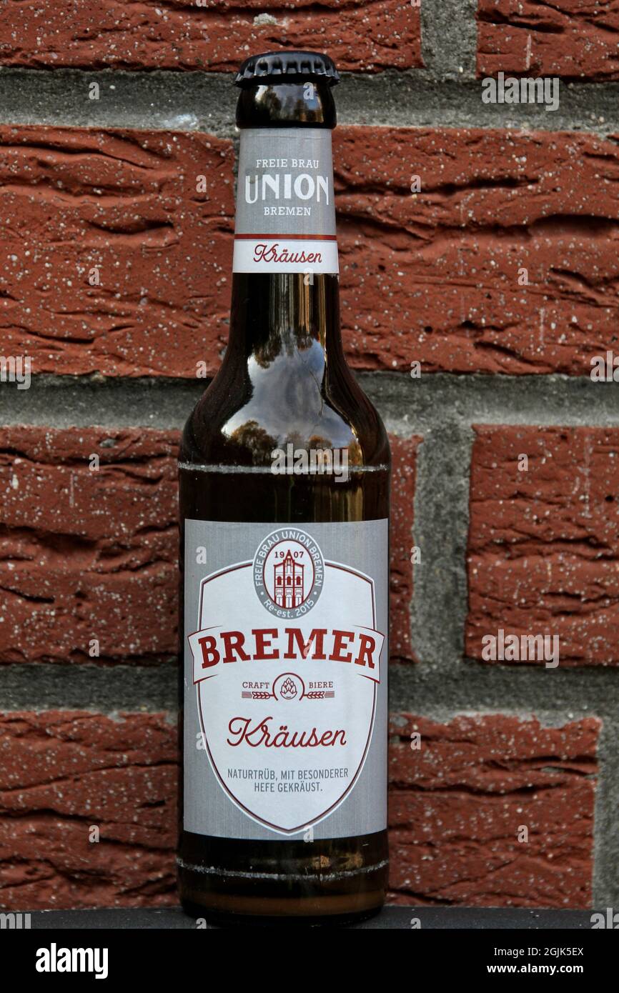 BREMEN, GERMANY - Sep 02, 2021: it is a so-called kraeusen beerthe bottle is in front of a wall the label is gray with red writing Stock Photo