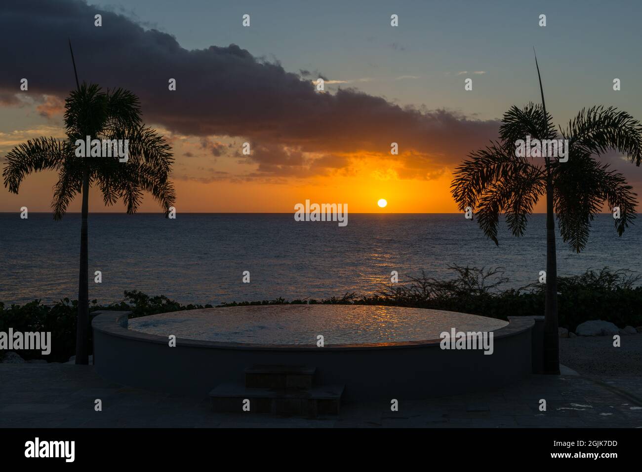 Summer and winter vacation destination, views of Curacao island, with private swimming poo, tropical flora and blue water of Carribean sea Stock Photo