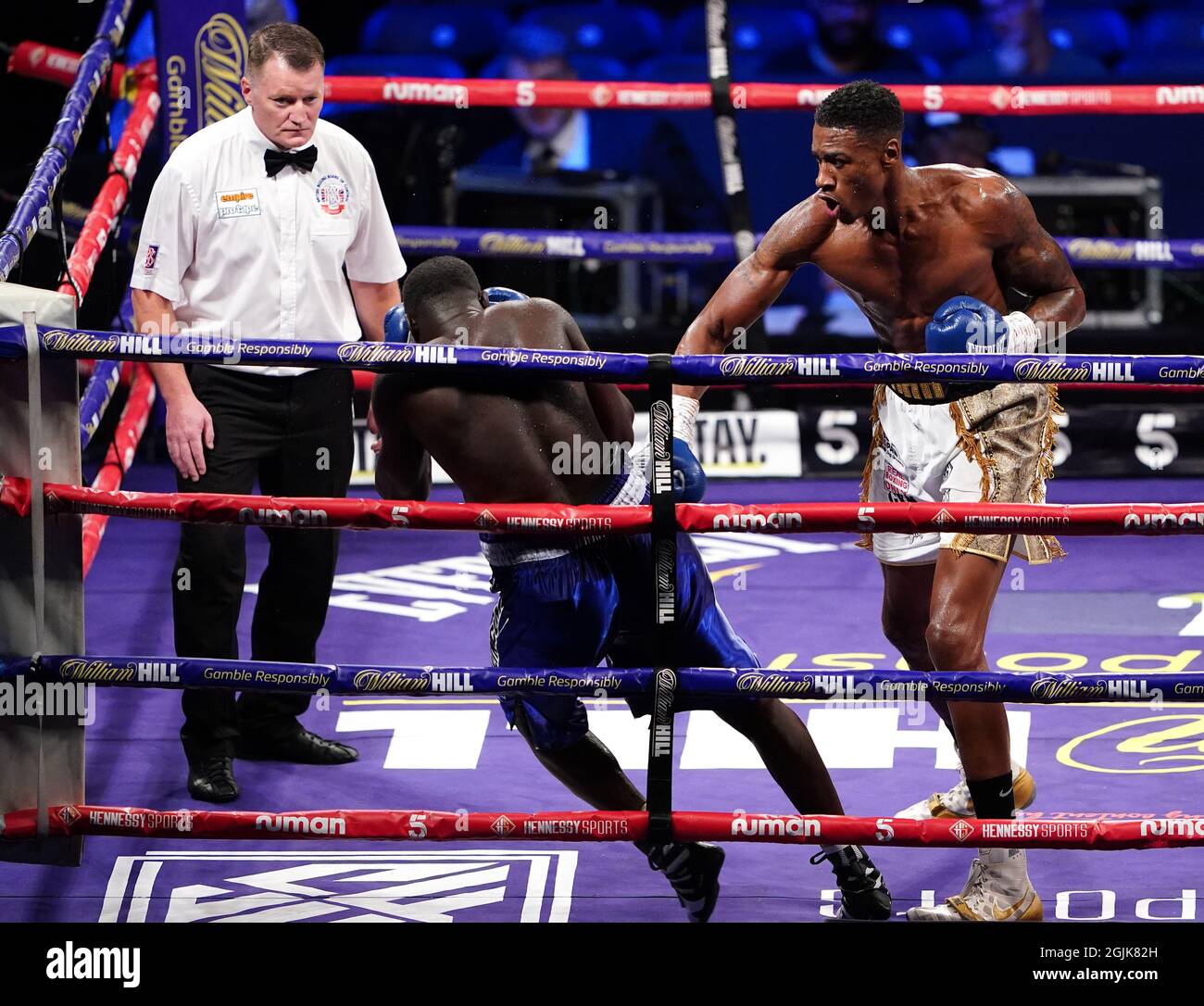 Shakan Pitters (right) knocks down Farouk Daku during the boxing event at the Coventry Skydome Arena. Picture date: Friday September 10, 2021. Stock Photo