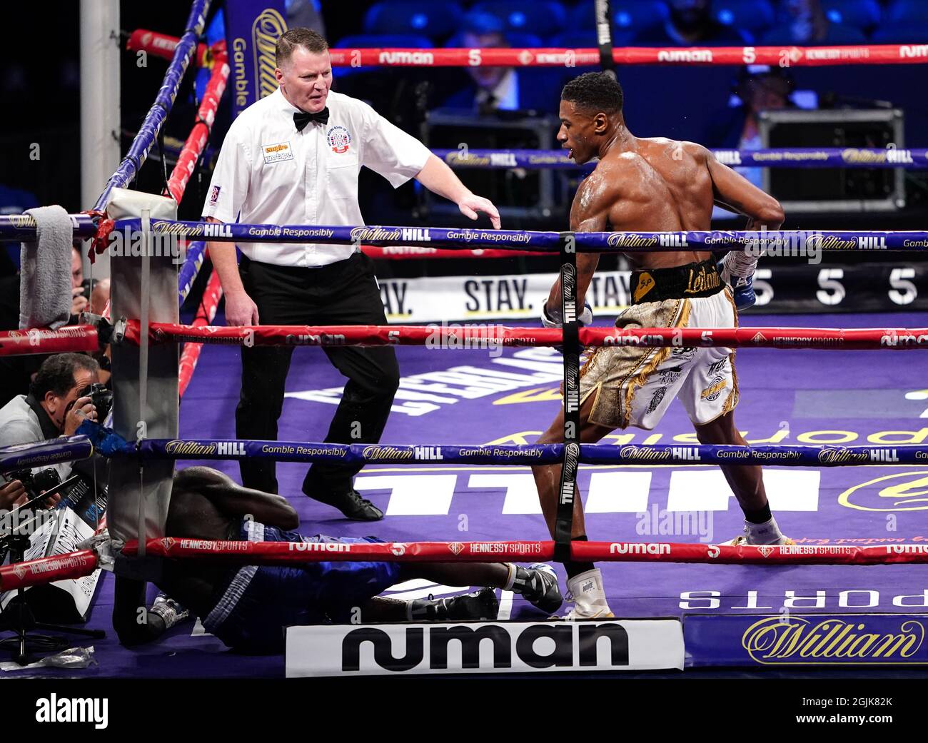 Shakan Pitters (right) knocks down Farouk Daku during the boxing event