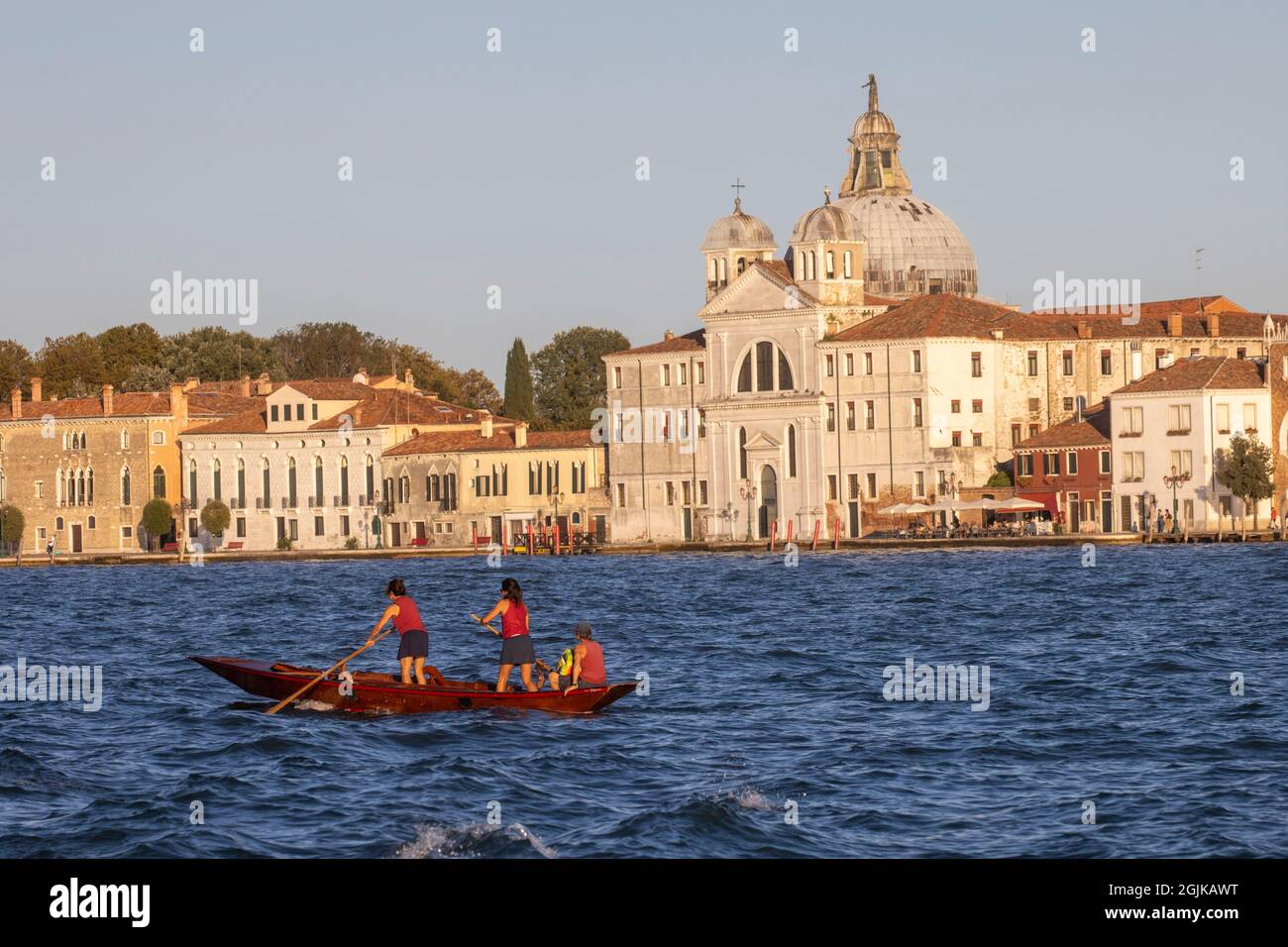Women rowing on the Grand Lagoon in Venice Stock Photo