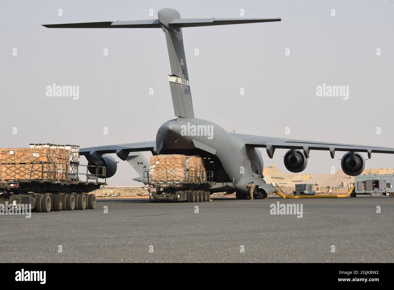 The 816th Expeditionary Airlift Squadron loads pallets of cots on to a