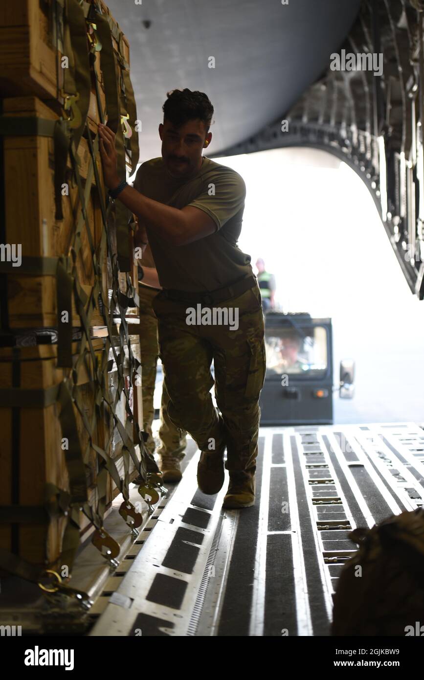 The 816th Expeditionary Airlift Squadron loads pallets of cots on to a U.S. Air Force C17