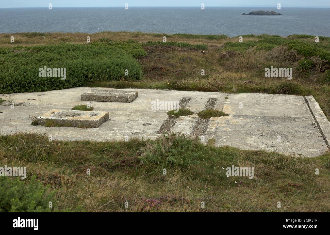 Newquay, Cornwall, England, 31st August 2021, concrete foundations of a world war 2 defensive post remain on the coast path. Stock Photo