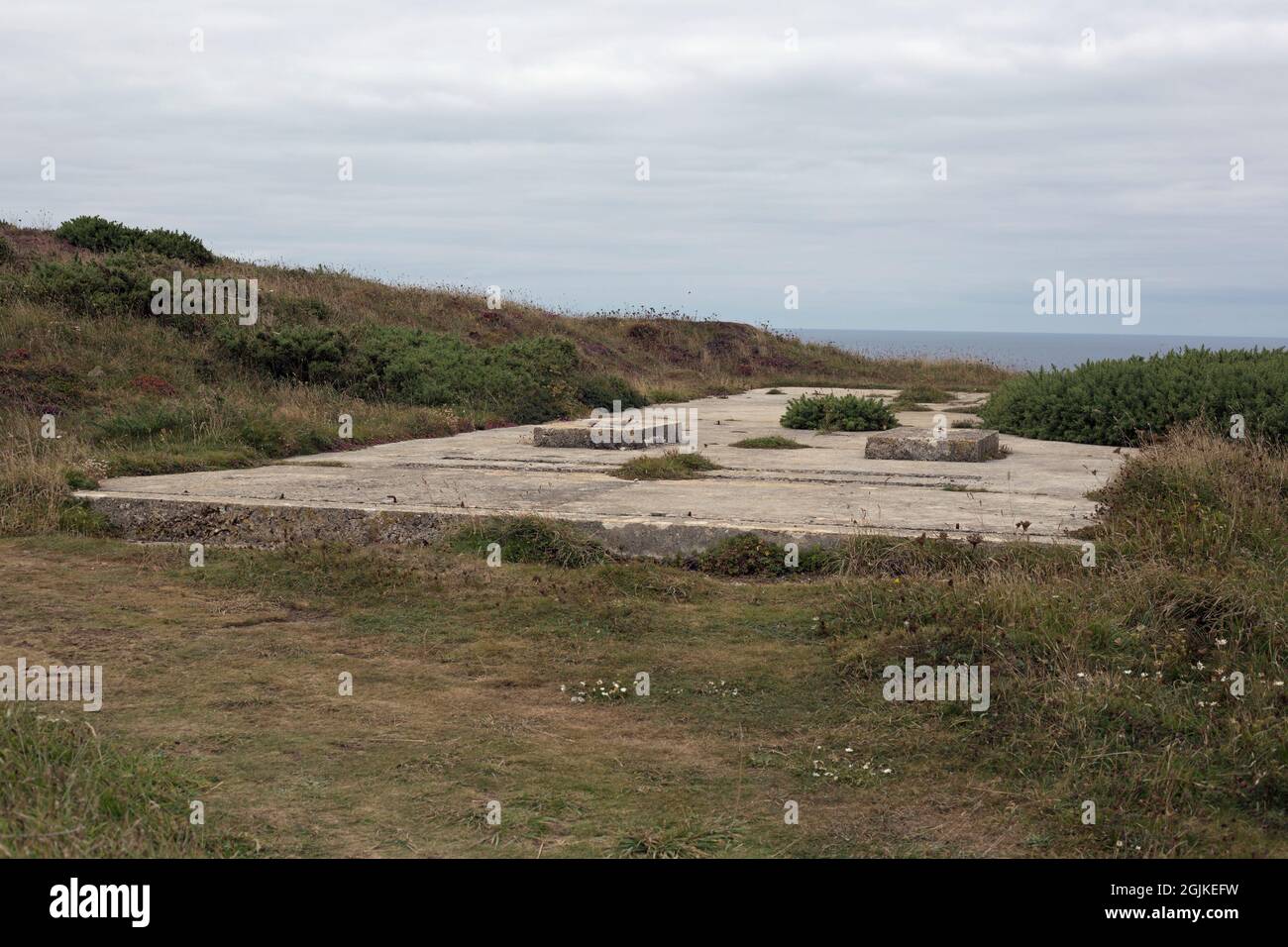 Newquay, Cornwall, England, 31st August 2021, concrete foundations of a world war 2 defensive post remain on the coast path. Stock Photo