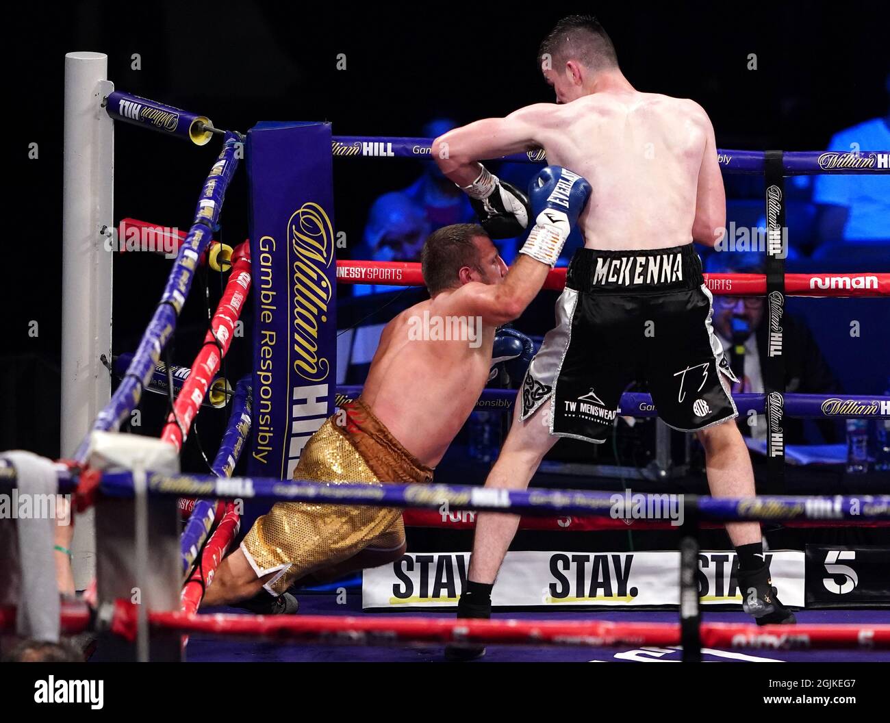 Aaron McKenna (right) knocks down Ivica Gogosevic during the boxing event at the Coventry Skydome Arena. Picture date: Friday September 10, 2021. Stock Photo