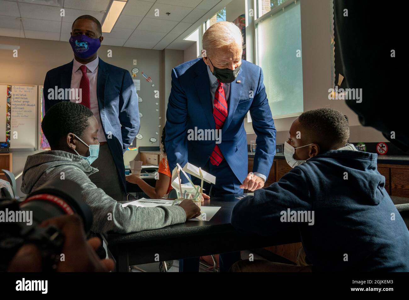 United States President Joe Biden, right, and principal, Kerry Richardson, left, visit a science classroom at Brookland Middle School in Washington, DC on Friday, September 10, 2021. Later the President will deliver remarks about how his administration is helping to keep students safe from Covid-19 in classrooms. Credit: Ken Cedeno/Pool via CNP Stock Photo