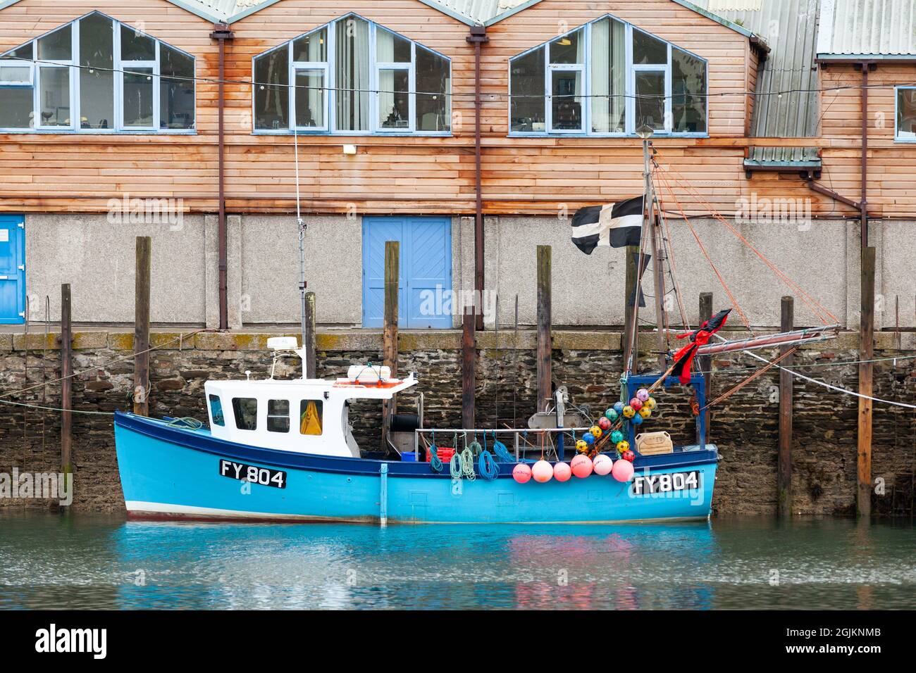 Fising boat with Cornish flag at East Looe quay Cornwall Stock Photo