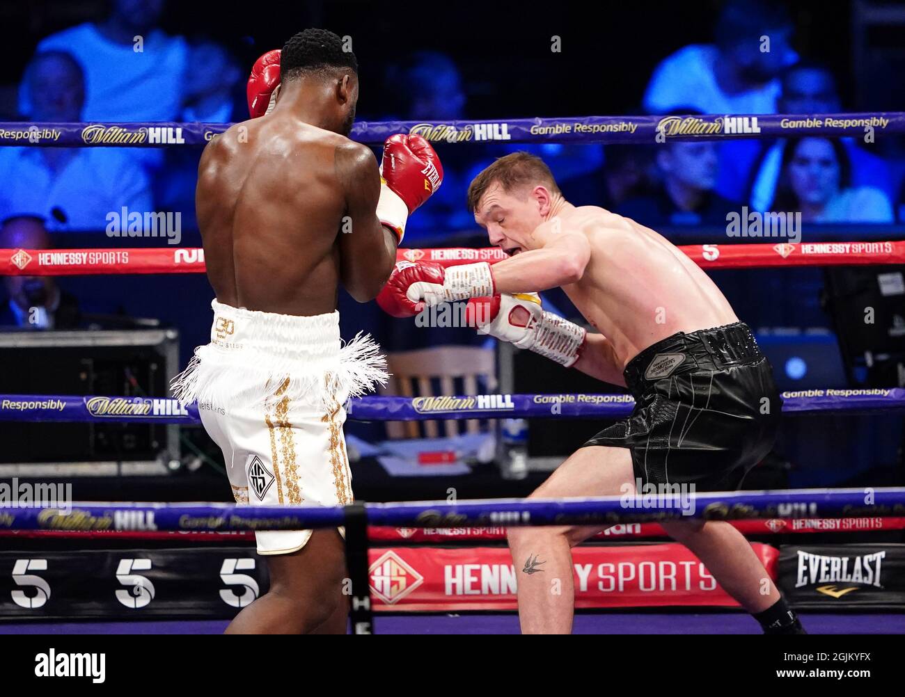 Isaac Chamberlain (left) in action against Ben Thomas during the boxing event at the Coventry Skydome Arena. Picture date: Friday September 10, 2021. Stock Photo