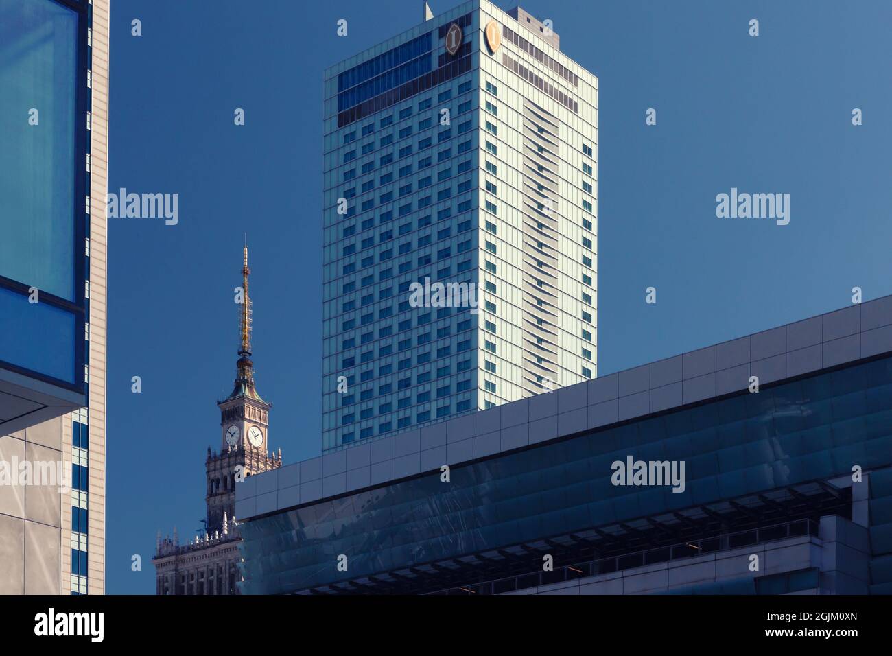 Warsaw, Poland - July 18th, 2021: Famous Palace of Culture and Science at the center of Warsaw surrounded by modern office buildings, Poland Stock Photo