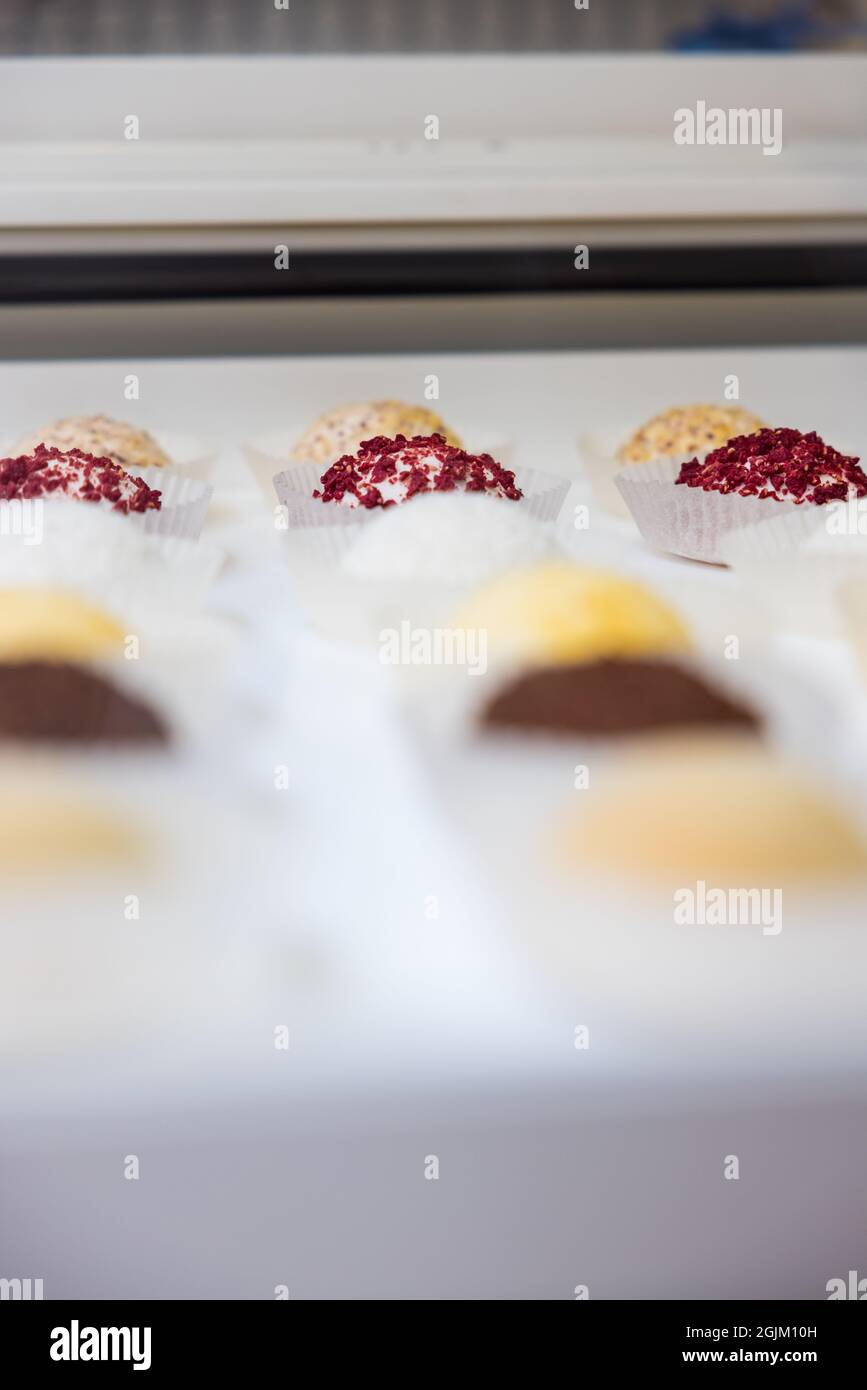 High angle shot of colorful desserts on a white counter Stock Photo - Alamy
