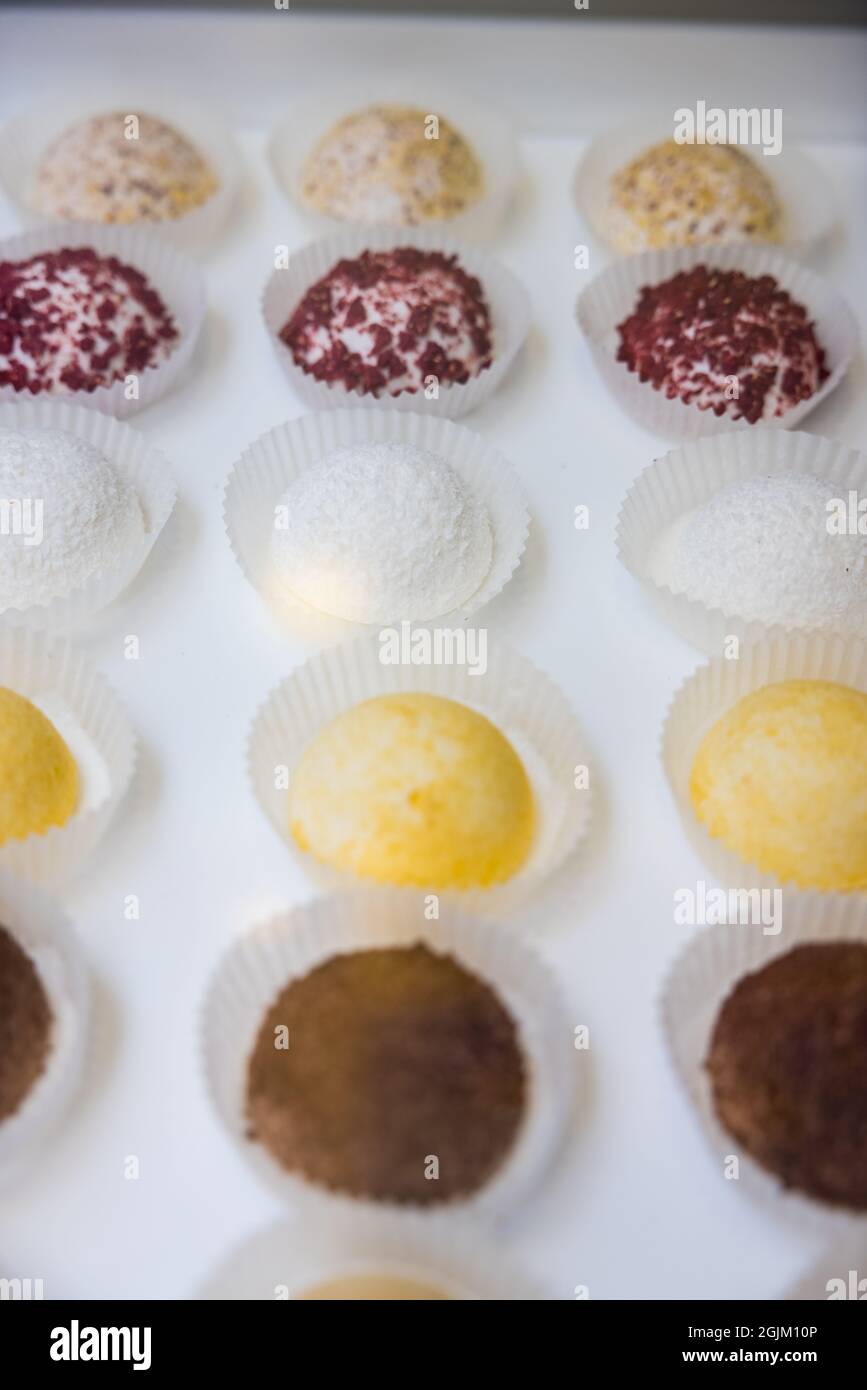 High angle shot of colorful desserts on a white counter Stock Photo - Alamy
